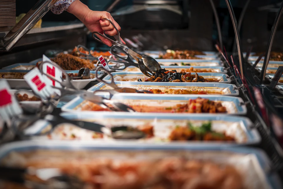 Person holding stainless steel fork