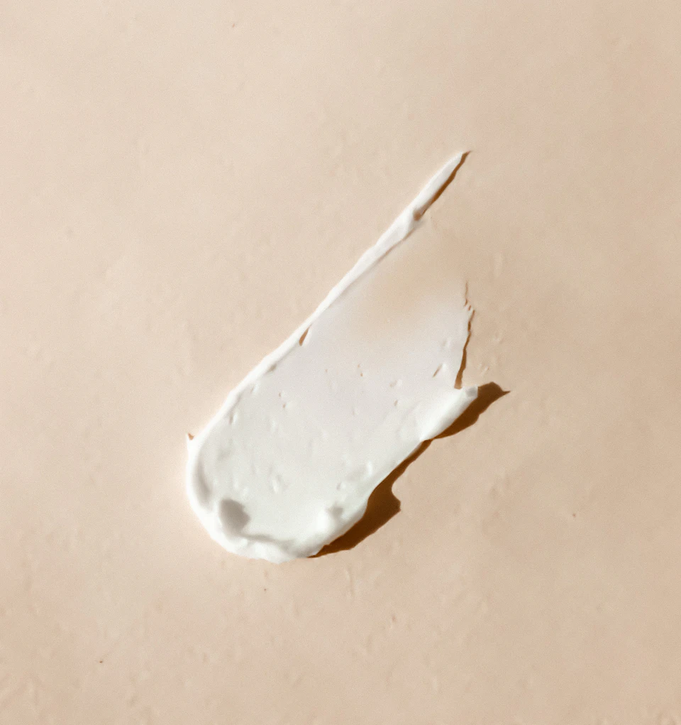 White cream smear on beige surface